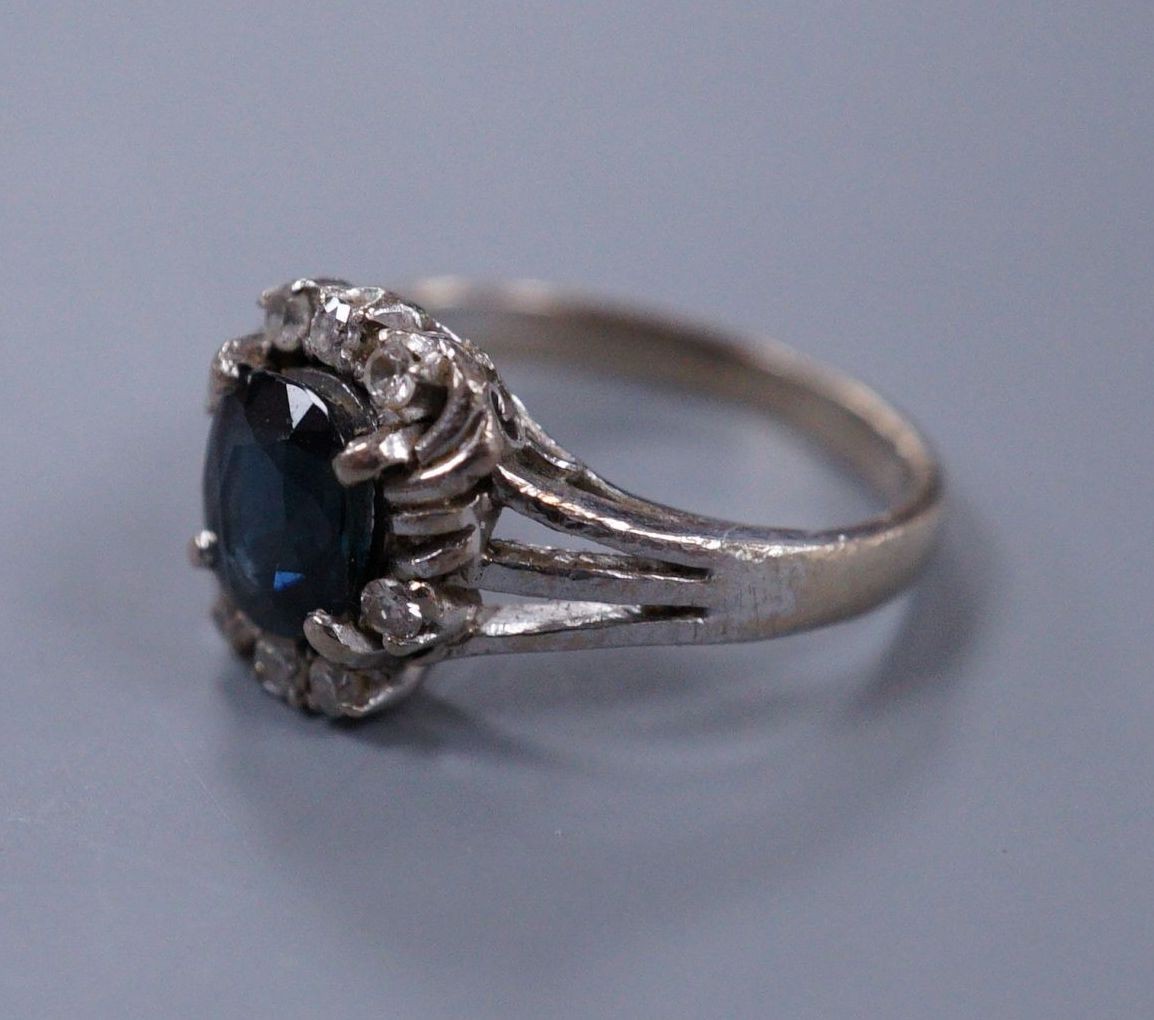 An 18ct white gold sapphire and diamond dress ring, size I